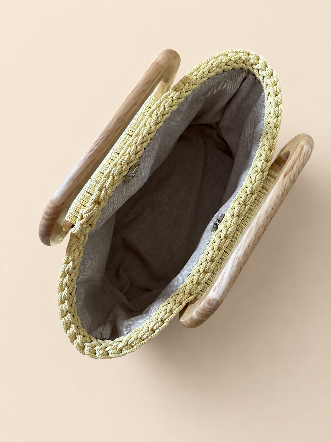 Handbag with wooden handles in light yellow color