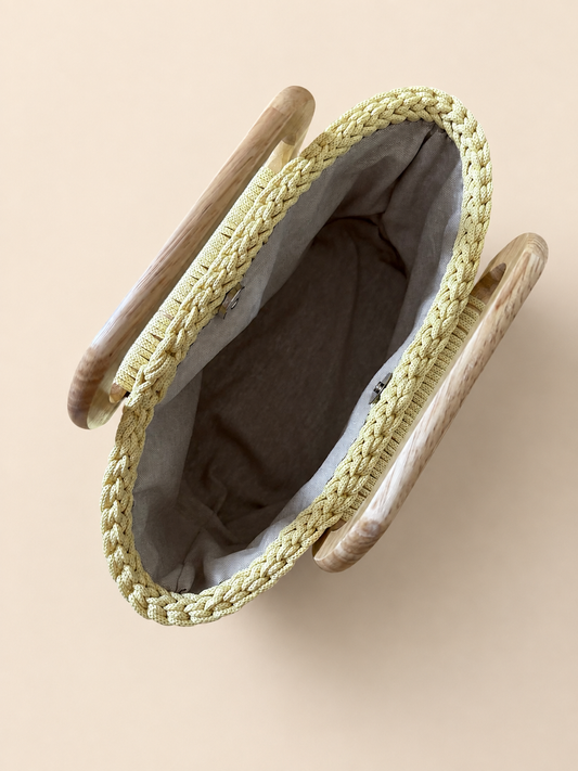 Handbag with wooden handles in light yellow color